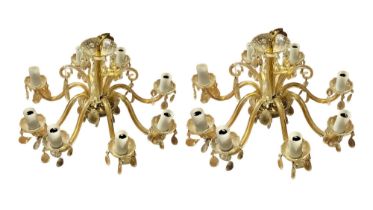 A LARGE PAIR OF 20TH CENTURY ITALIAN DESIGN CUT GLASS CHANDELIERS Having eight branch arms with gilt