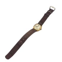 AN EARLY 20TH CENTURY 9ct GOLD GENTS WRISTWATCH Square form case on brown fabric strap, silver