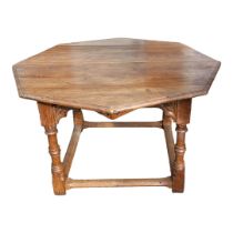 A 19TH CENTURY FRENCH GOTHIC PINE EXTENDING CENTER/DINING TABLE With hexagonal top, on turned legs