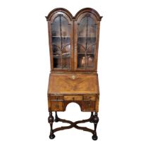 A 19TH CENTURY QUEEN ANNE STYLE LADIES’ WALNUT BUREAU BOOKCASE The double dome top with two glazed