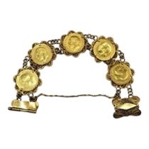 AN EARLY 20TH CENTURY 22CT GOLD HALF SOVEREIGN FIVE COIN BRACELET Having a row of five coins,