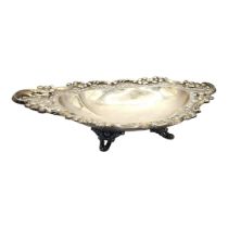 AN EDWARDIAN SILVER SWEETMEAT DISH Having a scrolled and pierced border, hallmarked S. Glass,