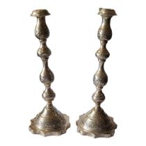 A PAIR OF VINTAGE SILVER CANDLESTICKS Having engraved decoration and scalloped base, hallmarked