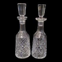 TWO LEAD CRYSTAL CUT GLASS DECANTERS AND STOPPERS (POSSIBLY WATERFORD AS WELL) The bodies panel