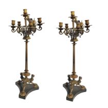 A PAIR OF REGENCY STYLE EARLY 20TH CENTURY BRONZE SIX BRANCH CANDELABRA The scrollwork arms below