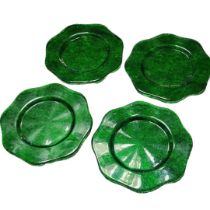 A SET OF FOUR LARGE MID CENTURY GREEN GLASS CHARGER PLATES Having a scalloped edge and textured