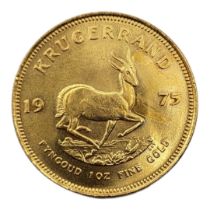 A 22CT GOLD FULL 1OZ KRUGERRAND COIN, DATED 1975 With portrait bust and springbok design to reverse,