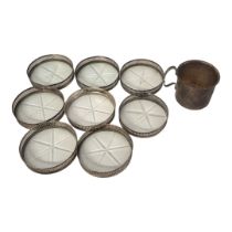 A SET OF EIGHT STERLING SILVER AND CUT GLASS COASTERS Having pierced gallery, together with a