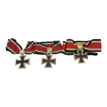 A COLLECTION OF THREE WWII GERMAN IRON CROSS WITH OAK LEAF MEDALS, DATED 1813 - 1939 (GOOD COPIES)