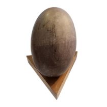 A VINTAGE INDIAN SHIVA LINGAM STONE Oval egg form, on fitted wooden base. (stone approx 22cm)
