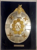 A QUEEN ELIZABETH II SILVER GILT 'INSIGNIA OF EUROPE' OVAL SHIELD With cherub mount and applied