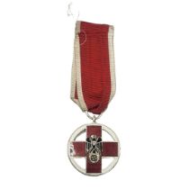 A WWII GERMAN RED CROSS DECORATION MEDAL Black enamel eagle on red and white enamel ground, on red