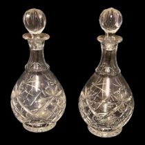 A PAIR OF EARLY 20TH CENTURY GLASS LEAD CRYSTAL DECANTERS AND STOPPERS Prussian globular body cut