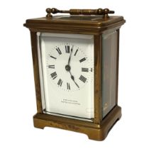 A 20TH CENTURY GILT BRASS CARRIAGE CLOCK Single handle and four bevelled glass panels, marked to