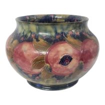 WILLIAM MOORCROFT, AN EARLY 20TH CENTURY OVOID POTTERY JARDINIÈRE, CIRCA 1920 Pomegranate pattern,