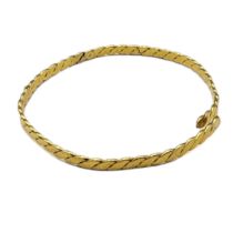 A VINTAGE 18CT GOLD BANGLE In a rope twist design. (approx 7cm) Condition: AF