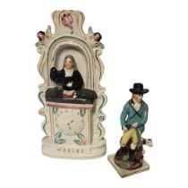 A VICTORIAN STAFFORDSHIRE FLATBACK POTTERY STAND Depicting John Wesley preaching a holy gospel,