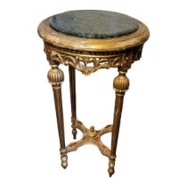 A FRENCH GILTWOOD AND GREEN MARBLE CIRCULAR PLANT STAND With pierced apron, melon section and reeded