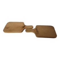 A FOLLOWER OF MOUSEMAN, A PAIR OF OAK CHEESE BOARDS. (20.5cm x 39cm) Condition: good overall