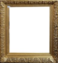 AN EARLY 20TH CENTURY GILDED GESSO PICTURE FRAME Moulded by flowering foliage. (76cm x 88cm)