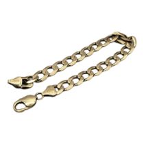 A VINTAGE 9CT GOLD CURB LINK BRACELET Flat links of plain design. (approx 21cm) Condition: good