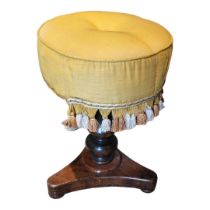 A VICTORIAN MAHOGANY CIRCULAR DRESSING STOOL With overstuffed yellow silk upholstered tasseled seat,