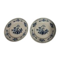 A PAIR OF 18TH CENTURY DUTCH DELFT POTTERY CHARGER DISHES Central cartouche of bamboo shoots and