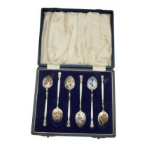 A SET OF SIX VINTAGE SILVER AND ENAMEL TEASPOONS Having painted floral decoration, hallmarked Barker