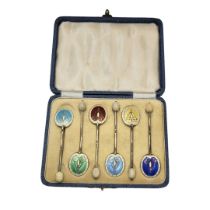 A SET OF SIX EARLY 20TH CENTURY SILVER AND ENAMEL COFFEE SPOONS Harlequin set with pottery bean