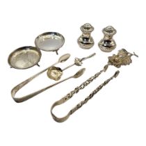 A COLLECTION OF GEORGIAN AND LATER SILVERWARE To include a pair of sugar tongs, a pair of butter