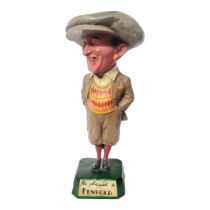 HE PLAYED A PENFOLD, AN ORIGINAL EARLY 20TH CENTURY GOLF SHOP ADVERTISING STATUE. (51cm)