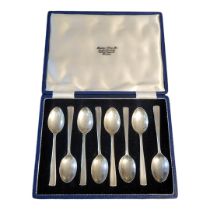 A SET OF EIGHT MID CENTURY SILVER TEASPOONS Plain form, in a fitted velvet lined box, hallmarked