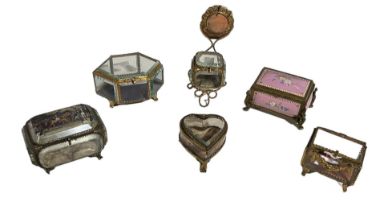 A COLLECTION OF FIVE 19TH CENTURY FRENCH GILT ORMOLU AND GLASS CASKETS One formed as a heart. (
