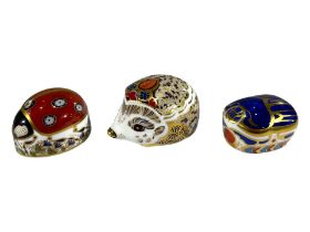 THREE ROYAL CROWN DERBY PAPERWEIGHTS Comprising Bramble Hedgehog, Millennium Bug Scarab and Ladybug.