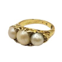 A VICTORIAN YELLOW METAL, THREE PEARL AND DIAMOND RING (YELLOW METAL TESTS AS 14CT) Central pearl (