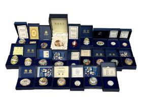 HALCYON DAYS, A COLLECTION OF TWENTY FOUR CASED ENAMEL TRINKET BOXES Depicting various subjects to