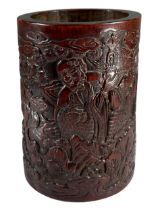 A 19TH CENTURY CHINESE CARVED BAMBOO BRUSH POT Decorated with figures amongst foliage and