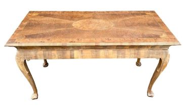 MANNER OF DAVID LINLEY, A GEORGE II DESIGN WALNUT AND OYSTER VENEERED SERVING TABLE The inlay top