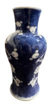 A 19TH CENTURY CHINESE BALUSTER FORM BLUE AND WHITE POSIE VASE Bearing a four character mark to