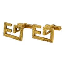 A VINTAGE PAIR OF YELLOW METAL MONOGRAMMED CUFFLINKS (YELLOW METAL TESTS AS 9CT) Having textured