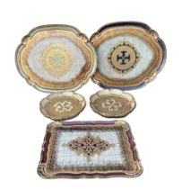 FIVE ITALIAN VENETIAN PAPIER-MACHE TRAYS. (largest 51.5cm x 42cm)