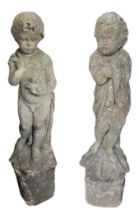 A PAIR OF 18TH CENTURY CARVED MARBLE STATUES OF CHERUBS Standing wearing drapery on upon a scallop