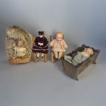 ARMAND MARSEILLE, A NOVELTY BISQUE HEADED DOLL In original Thuringian black forest wooden cradle,