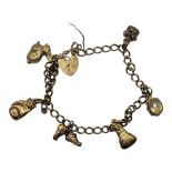 A VINTAGE 9CT GOLD CHARM BRACELET Set with six charms and heart form clasp. (approx 20cm) Condition: