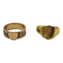 AN EARLY 20TH CENTURY YELLOW METAL GENTS SIGNET RING Having a shield form mount, together with a