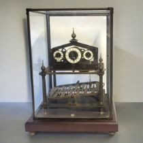 A LARGE BRASS SKELETON MANTLE CLOCK having five glazed panels, three white dials depicting hours/