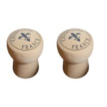 A PAIR OF CHAMPAGNE CORK STOOLS Having ‘Champagne France’ and fleur-de-lis insignia on the seat. (