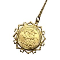 AN EARLY 22CT GOLD FULL SOVEREIGN COIN PENDANT, DATED 1928 With King George V portrait and Geoge and