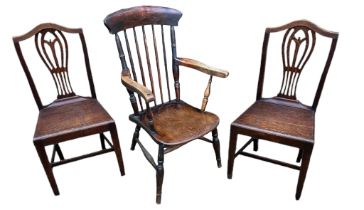 A PAIR OF 18TH CENTURY OAK CHAIRS With pierced vase splat backs, solid seats,on square chamfered