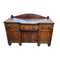 A REGENCY PERIOD MAHOGANY SIDE CABINET AND EBONY LINE INLAY With three drawers above cupboards, on